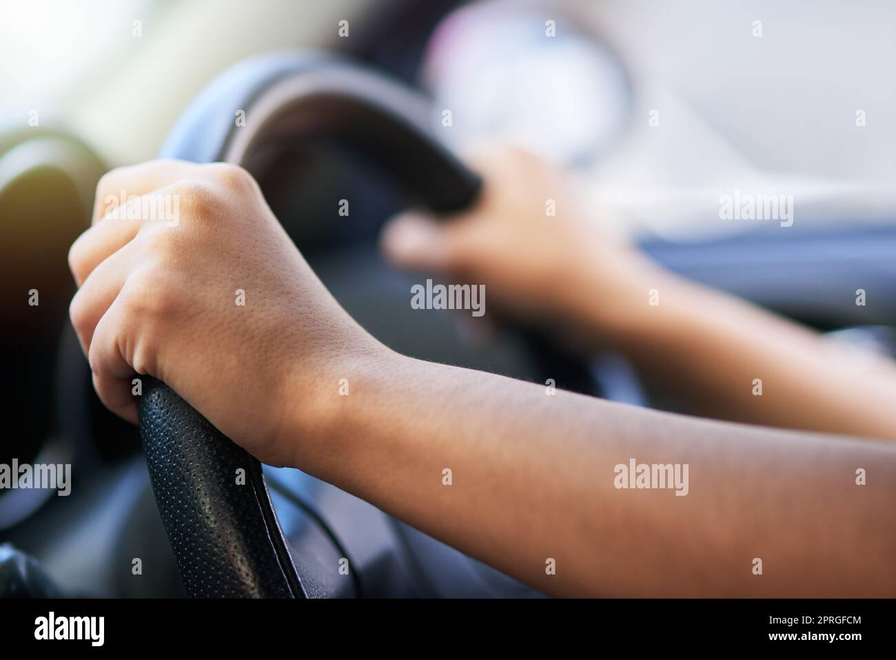 Power steering makes for smooth driving. hands holding onto a steering