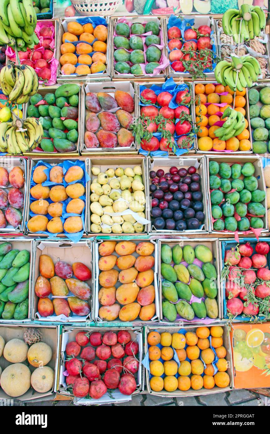 Fruit trays for sale of mangoes, pomegranates, bananas, plums, guava