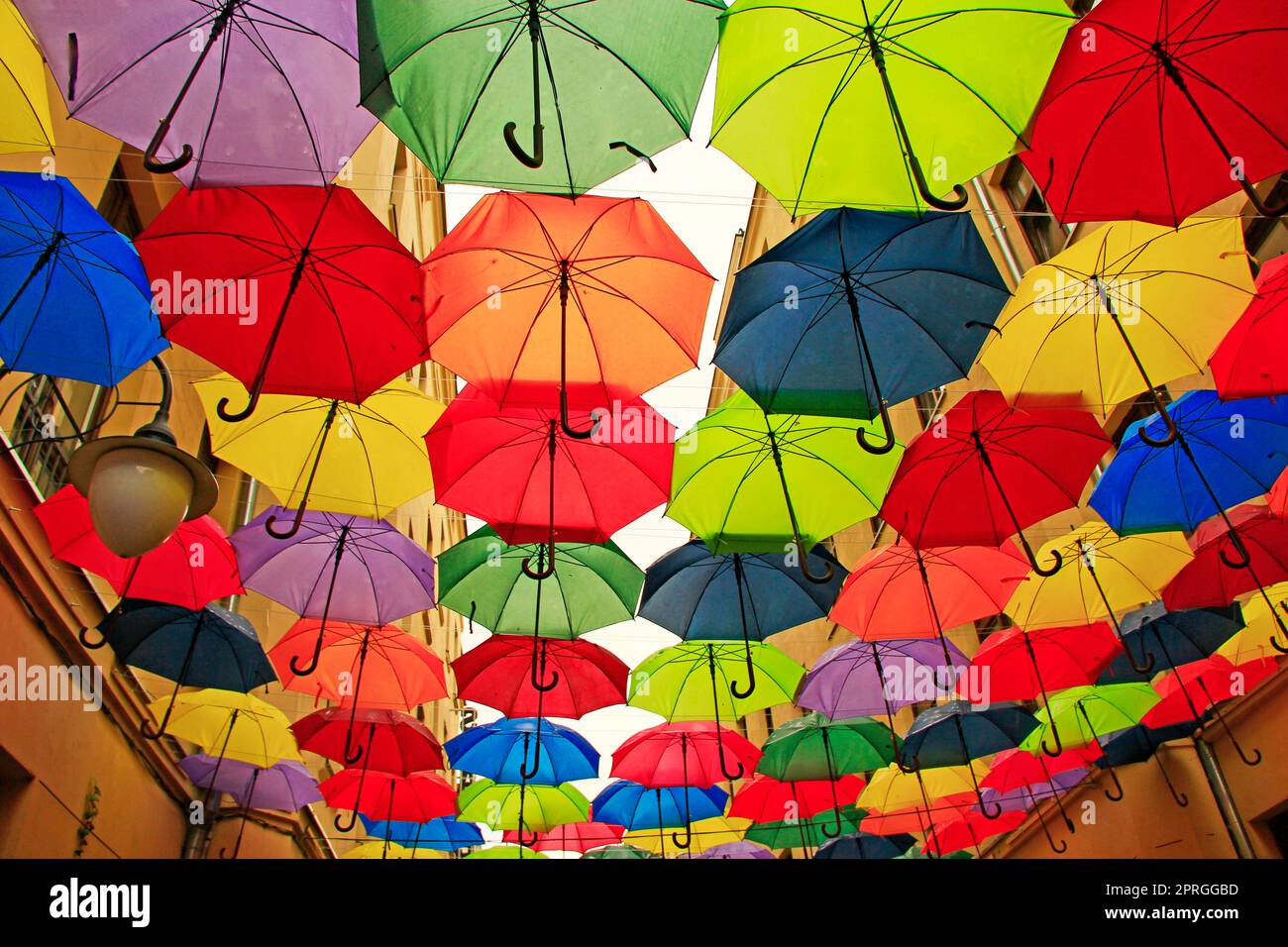 Colored umbrellas hanging at the top. Local landmark. Bold colors Stock Photo