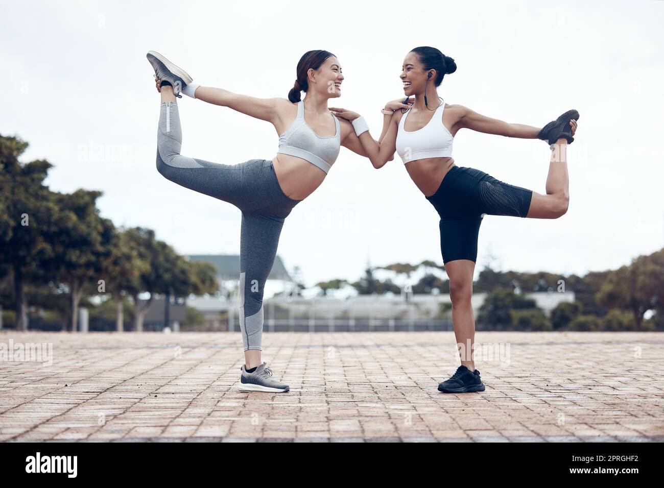Women, fitness and stretching, exercise and training together, motivation for healthy and active lifestyle. Young, happy and workout with friends, yog Stock Photo