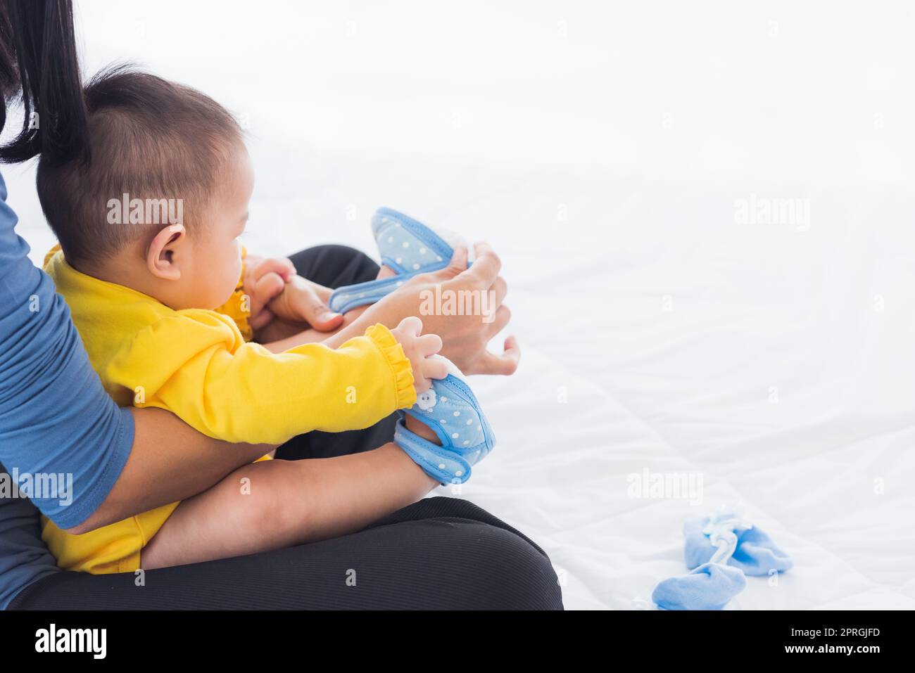 Baby wearing shoes hires stock photography and images Alamy