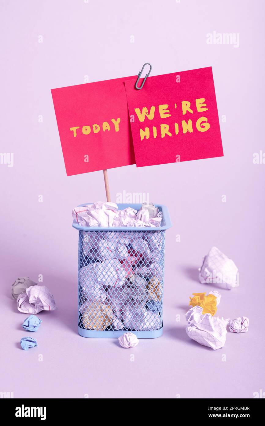 Conceptual display We Re Are Hiring. Concept meaning Advertising Employment Workforce Placement New Job Case Full Of Paper Wraps And Two Important Messages Pinned On Stick. Stock Photo
