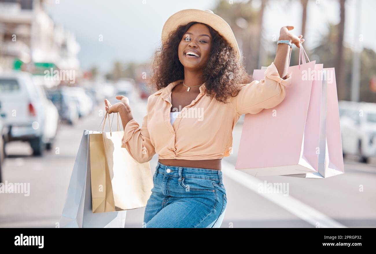 Fashion black woman with shopping bags in city or happy with sale, discount  or luxury retail brands of clothes. Customer with smile, boutique products  Stock Photo - Alamy