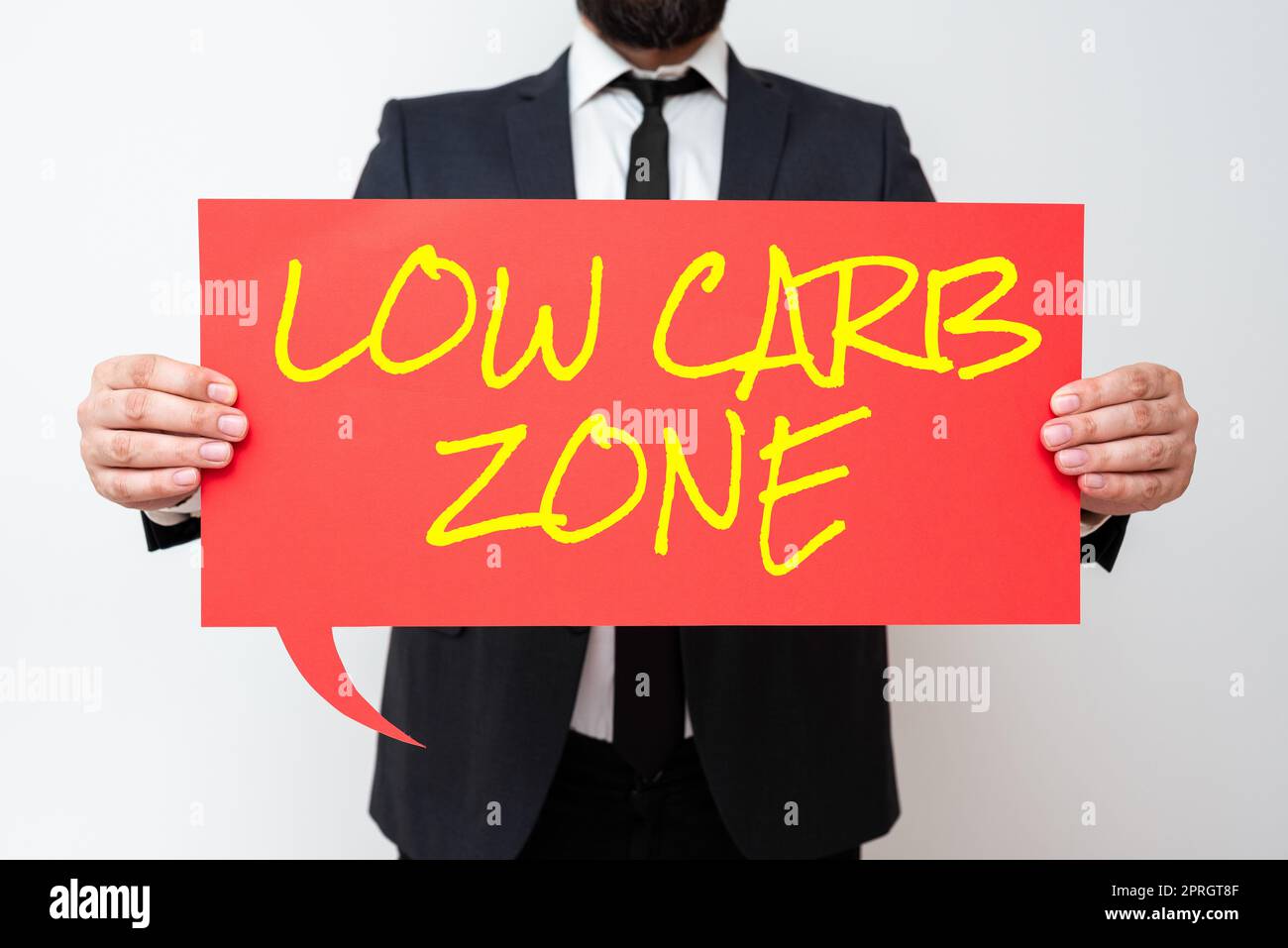 Conceptual display Low Carb Zone. Business concept Healthy diet for losing weight eating more proteins sugar free Businessman Holding Speech Bubble With Important Informations. Stock Photo