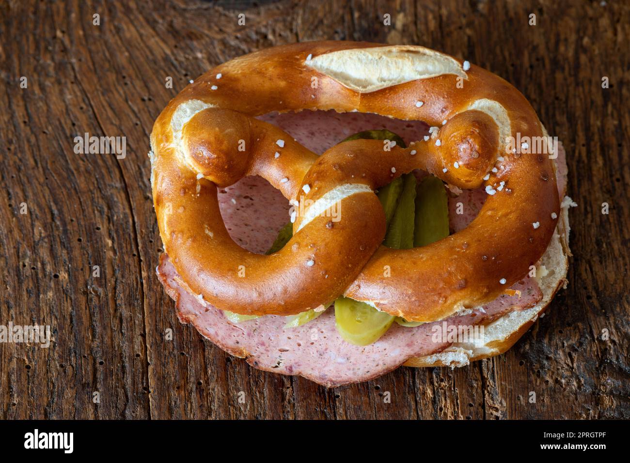 meatloaf slices in a pretzel on wood Stock Photo