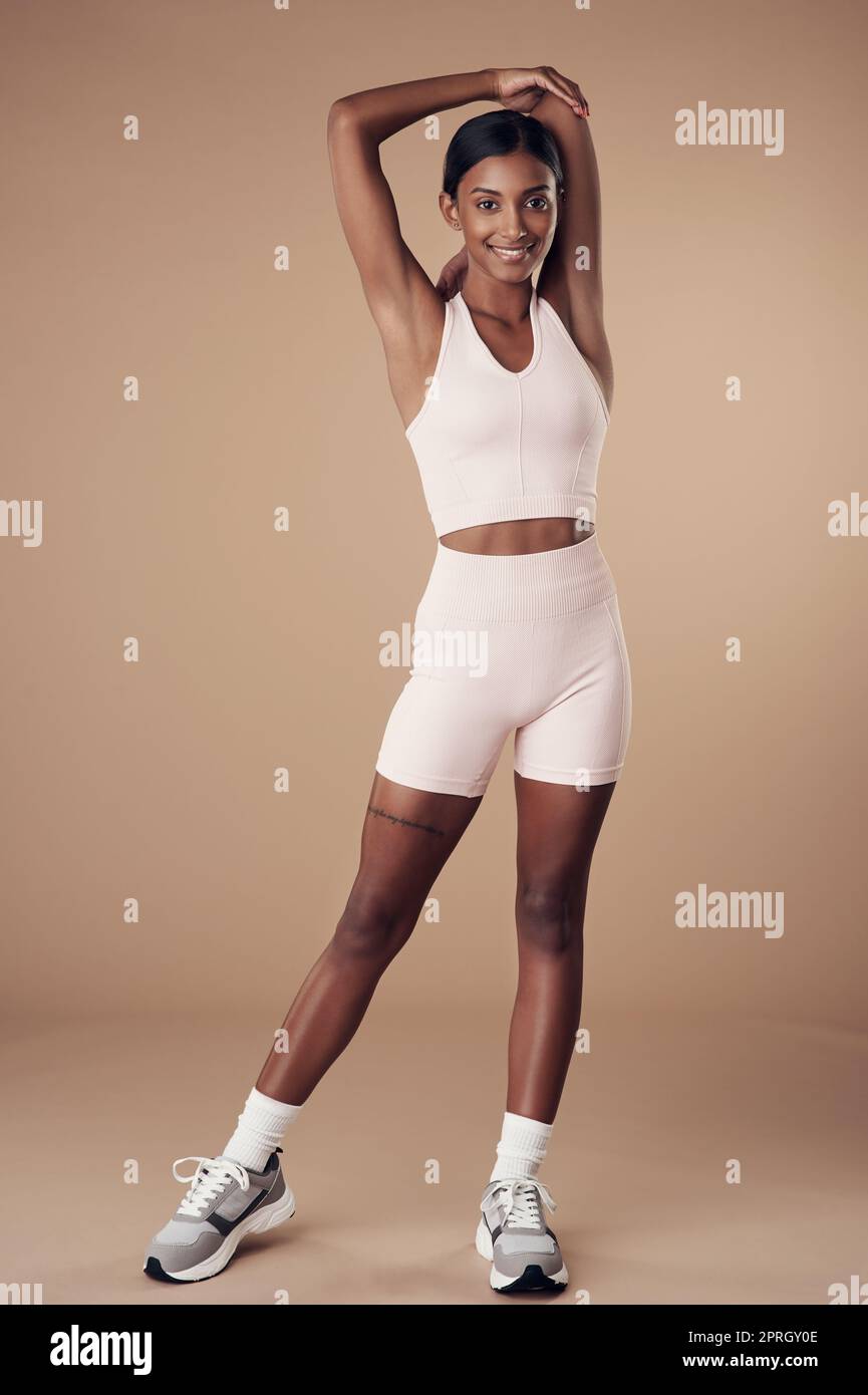 Stretching is part of my workout routine. Full length shot of an