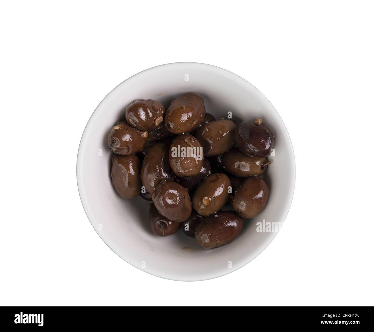 black olives in a white bowl in a transparent background Stock Photo