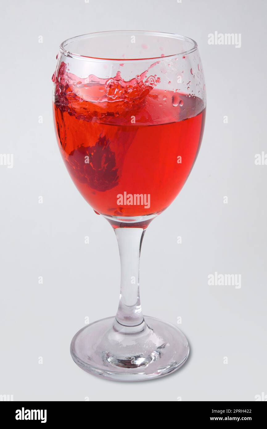 raspberry fruity mix splash glass of wine red liquid fruit splashing