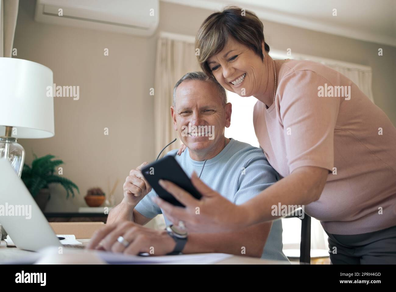 What do you think about this. a husband and wife taking a selfie together Stock Photo