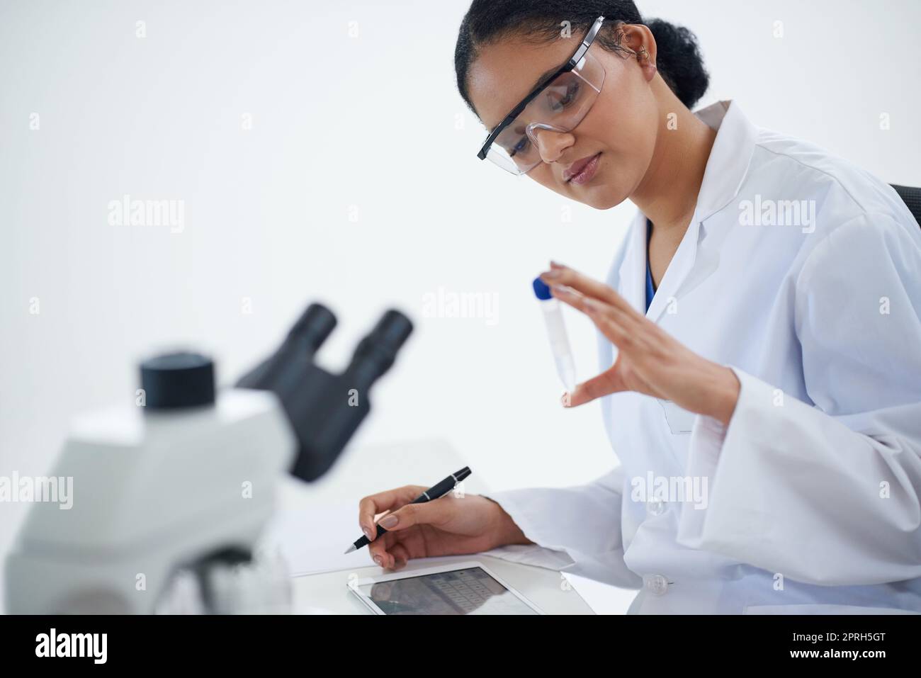 This could be the one...an attractive young female scientist working in her lab. Stock Photo