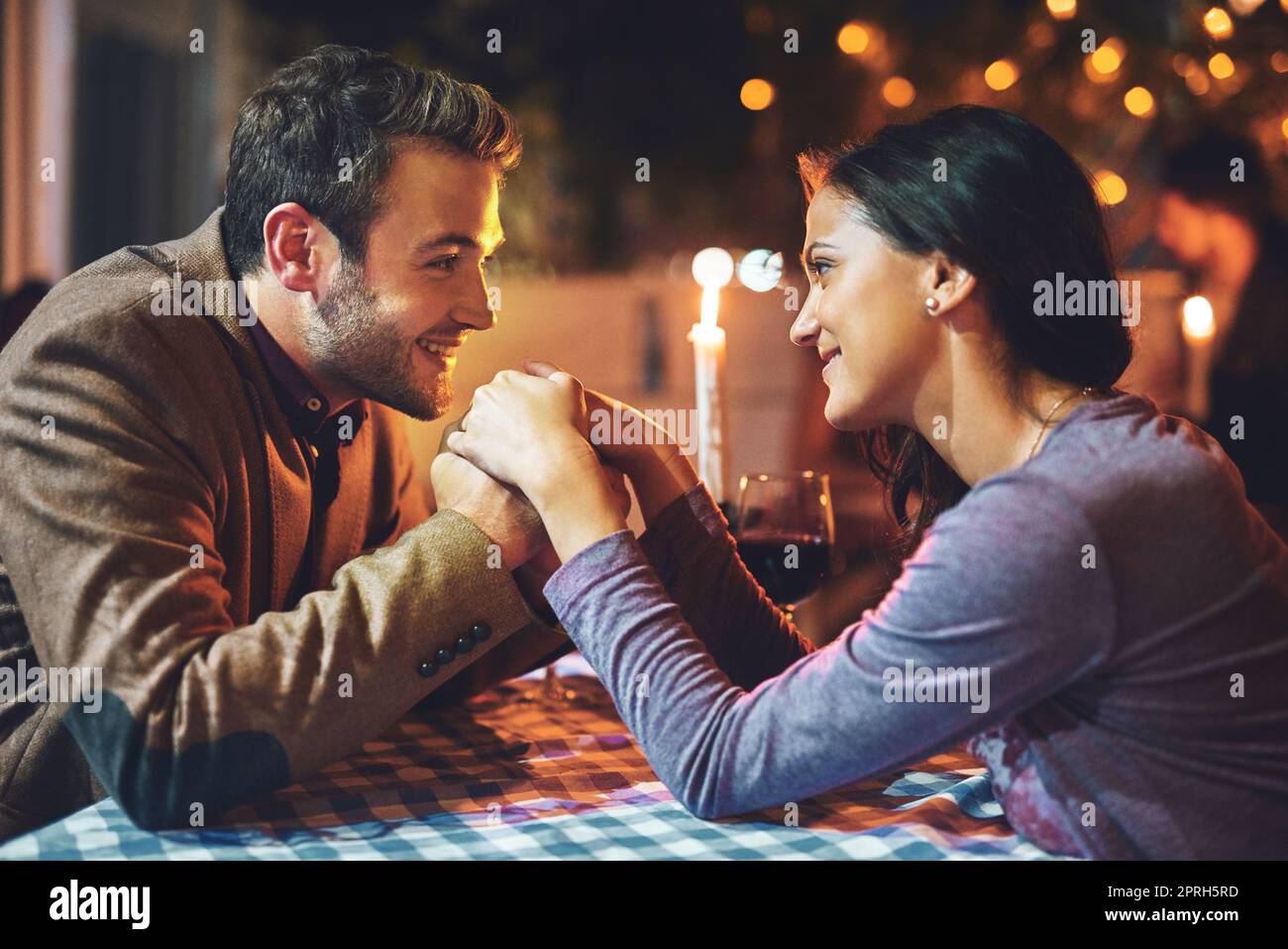 You are all that matters in this moment. an affectionate young couple having a romantic dinner in a restaurant. Stock Photo