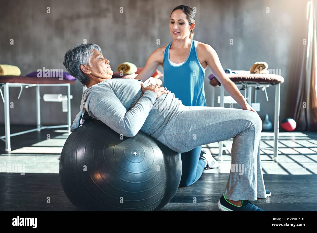 The senior years dont have to be the sedentary years. a senior woman working out with her physiotherapist. Stock Photo
