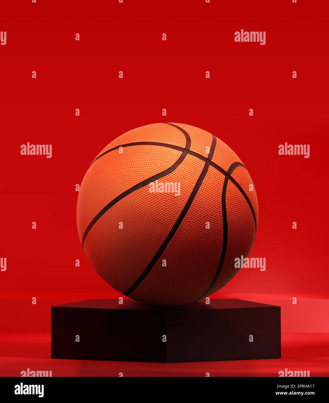 Basketball on black pentagon podium in the red studio Stock Photo
