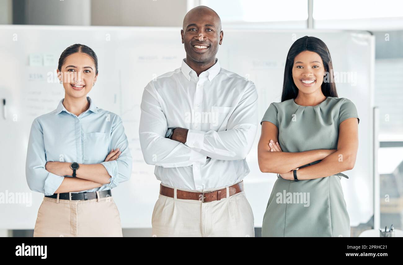 Team, leadership and diversity with portrait of business people standing with arms crossed in office. Women and black man leader working together for collaboration, innovation and mission for success Stock Photo