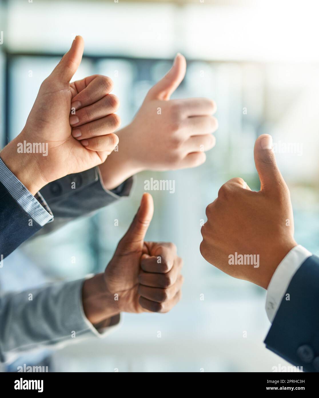That was outstanding. a group of office workers giving thumbs up together. Stock Photo