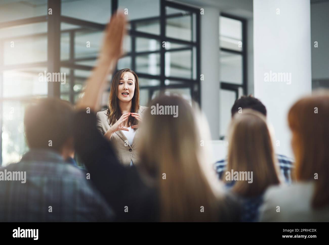 Shell answer as many questions as possible. a young businesswoman