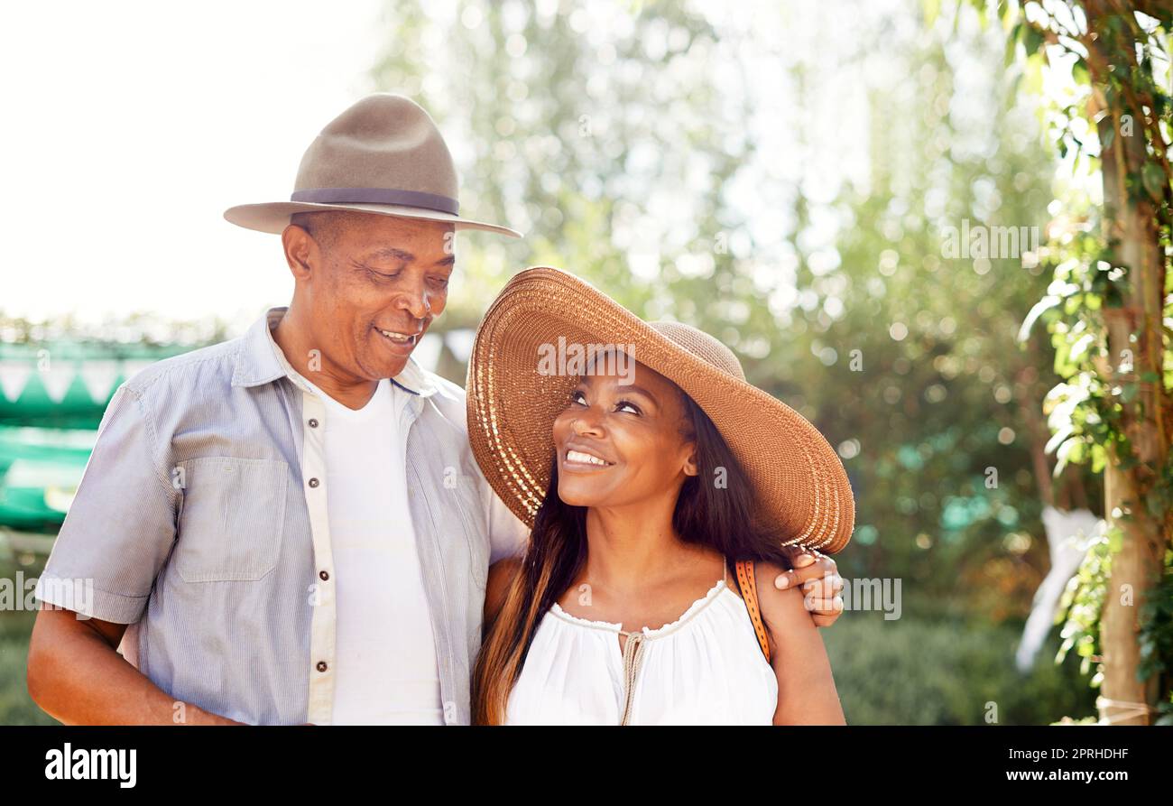 Hes the only man for me. a mature couple standing in their backyard. Stock Photo
