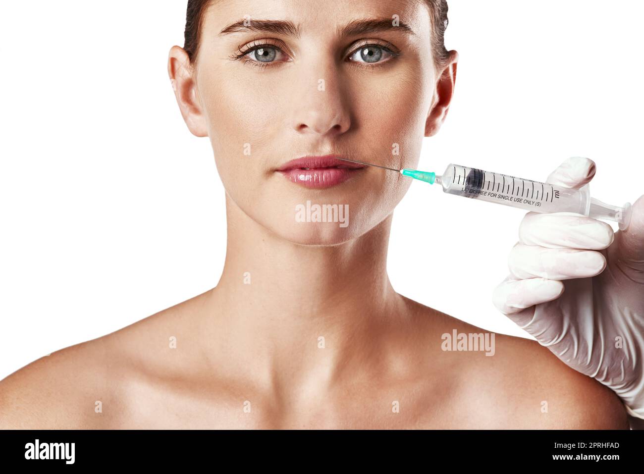 Winning the war against age. Studio shot of an attractive young woman getting an injection for cosmetic purposes. Stock Photo