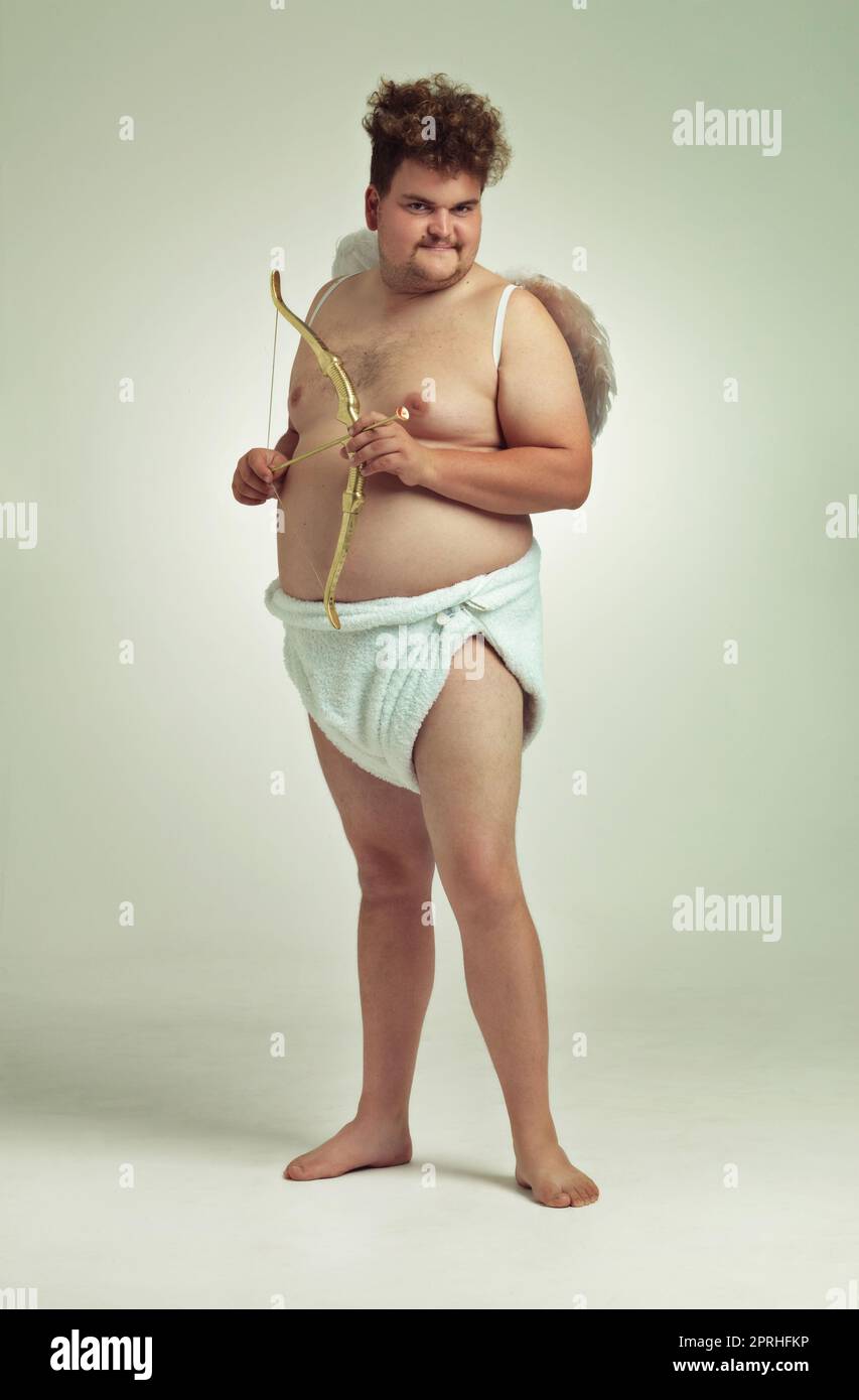 Hes bringing the love this Valentines. An obese man dressed as a cherub  with a bow and arrow Stock Photo - Alamy