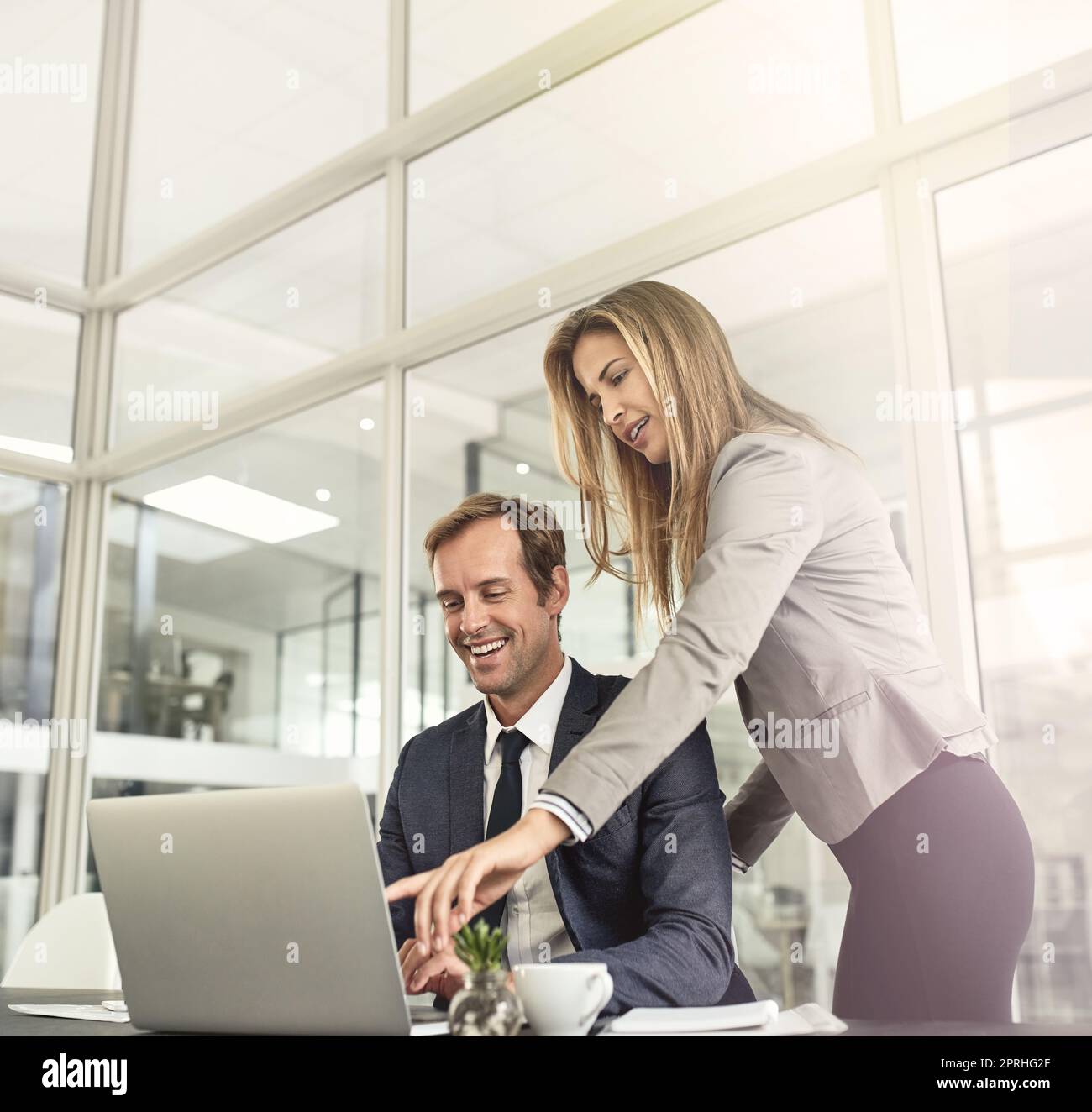 Building upon their successes. a two executives working together in an office. Stock Photo