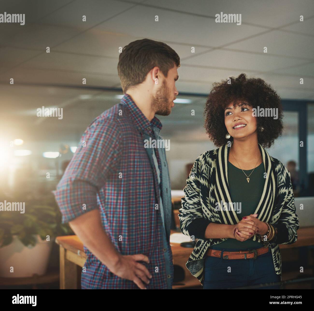 Catching up with her favorite colleague. colleagues talking in a modern office. Stock Photo