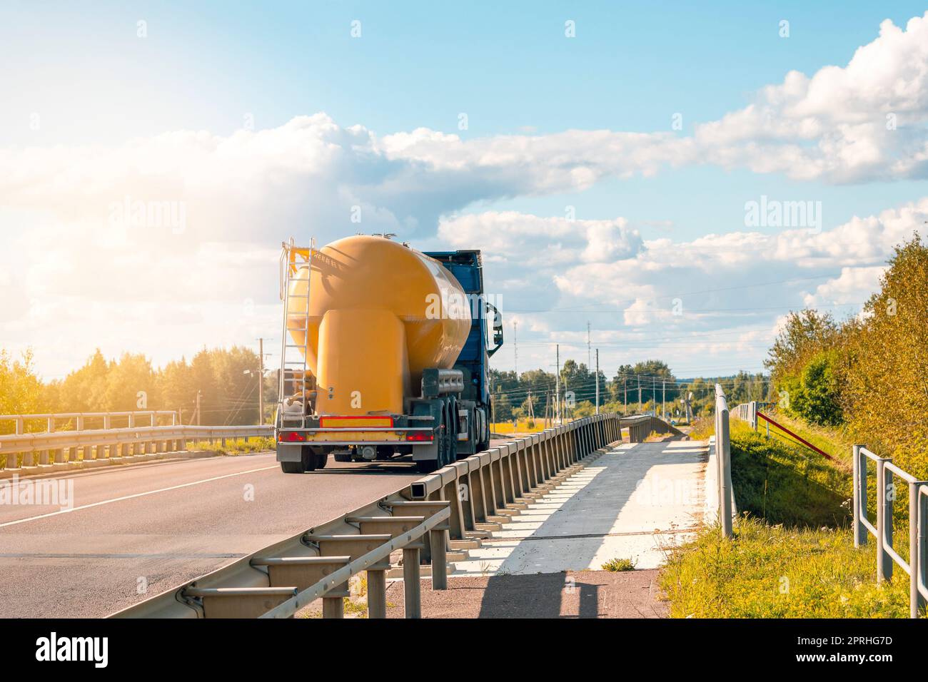 Big yellow truck tank on the roads of Europe Stock Photo