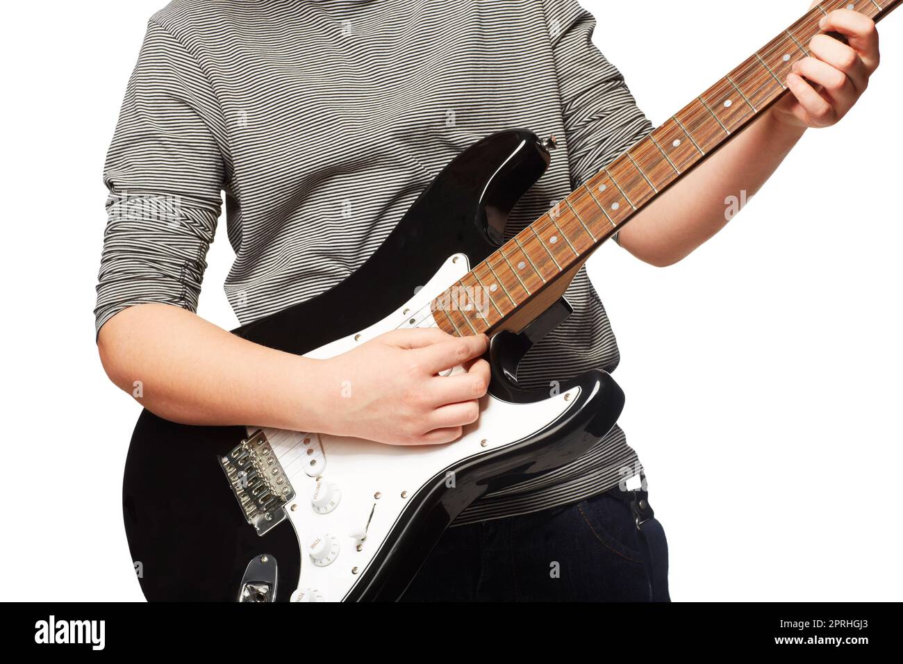 Getting to grips with chords. Cropped image of a young boy playing a