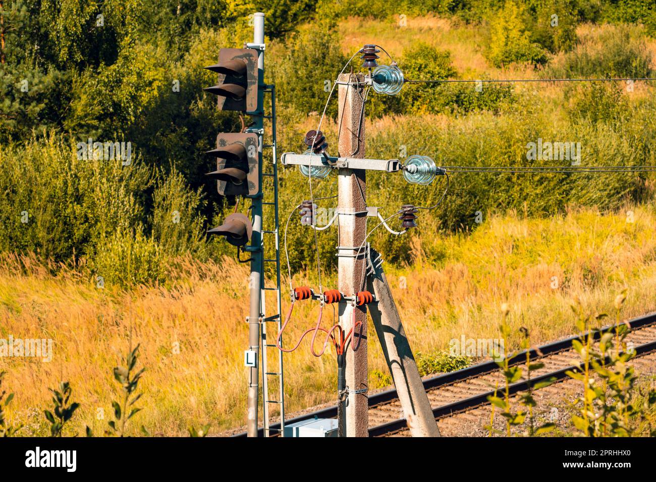 Electricity pylon next to railway Stock Photo