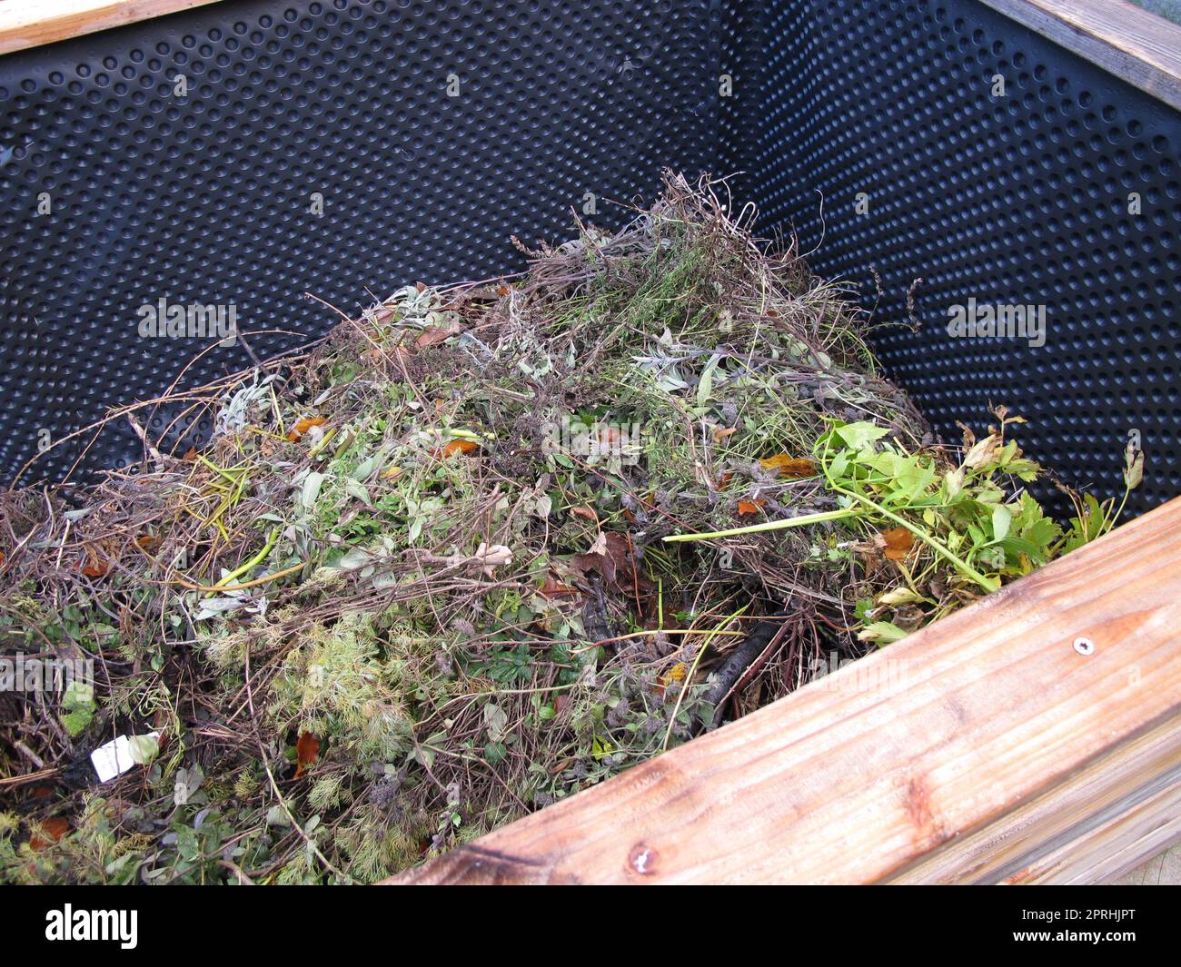 Raised bed filled up with organic material from the garden Stock Photo