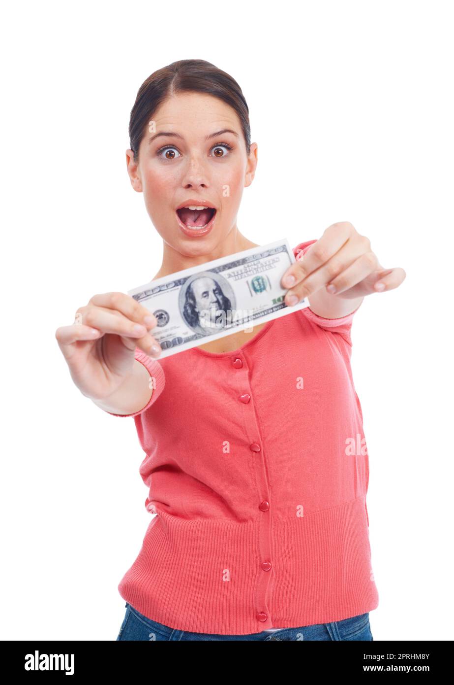 My first hard earned cash. Young woman holding a bill while looking at you in surprise Stock Photo