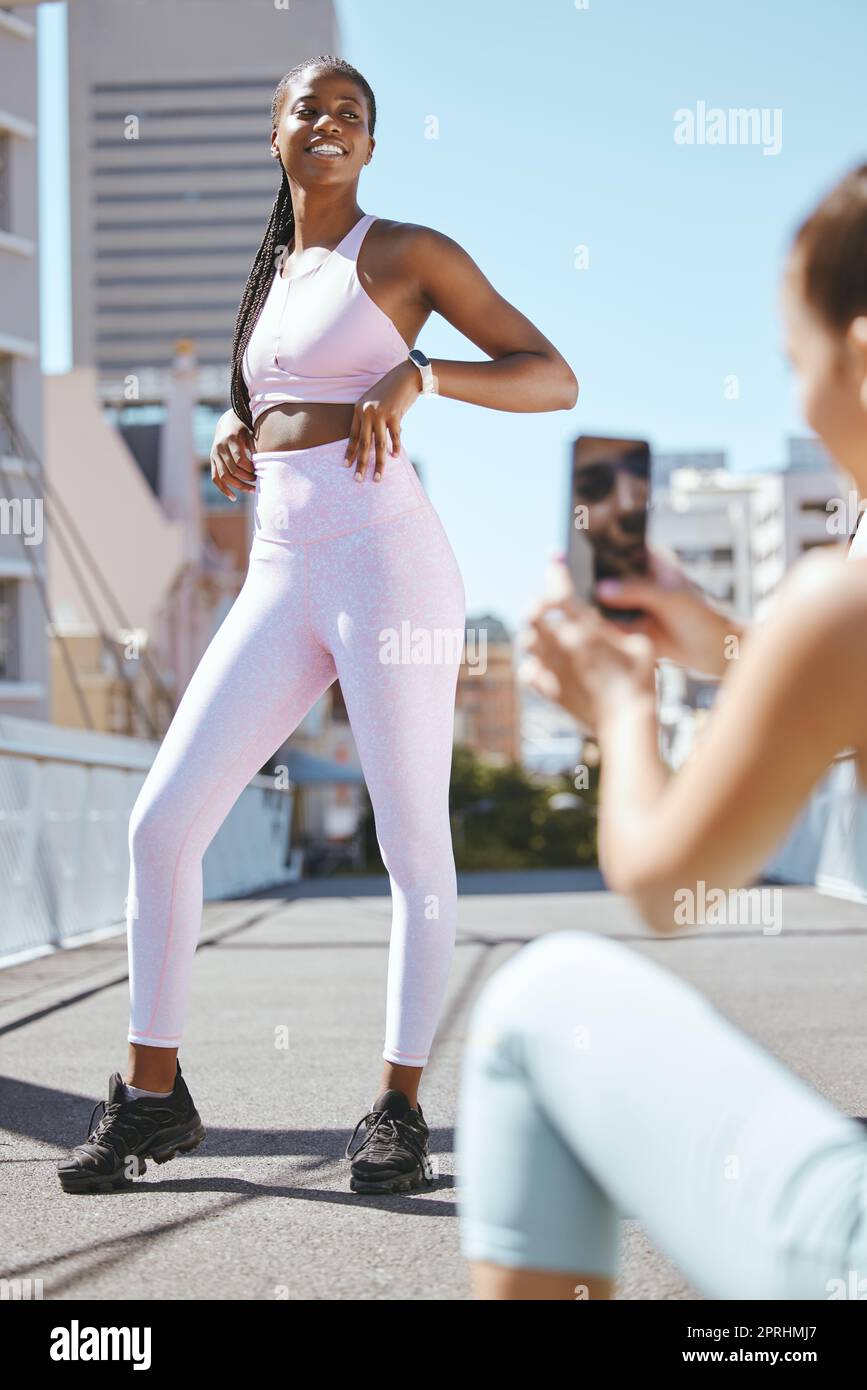 Fitness influencer friends with smartphone photo for social media update on  wellness lifestyle and body progress results. Gen z marketing girl taking  Stock Photo - Alamy