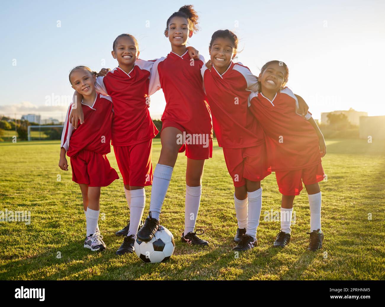 Soccer, team sports and portrait of children training for football game