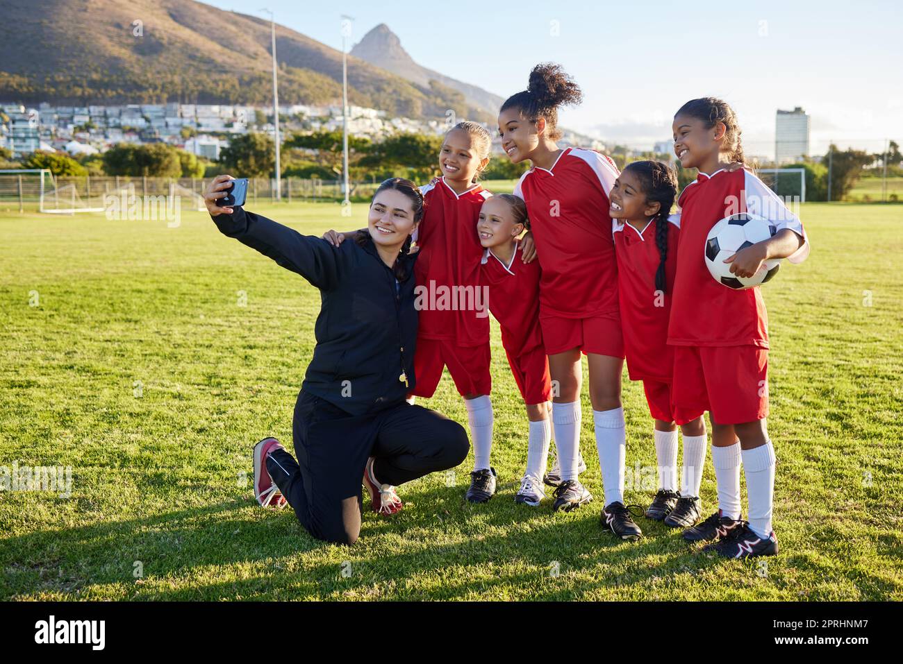 Soccer, team and coach selfie with phone on a field after training,  practice or game at a sports club. Football girl group smile and happy with  photo Stock Photo - Alamy