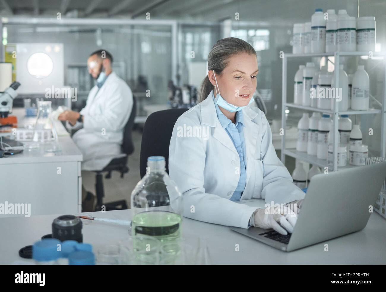 Science woman, expert and laptop laboratory research, medical innovation and biology test online. Senior analytics scientist, desktop data and physics Stock Photo