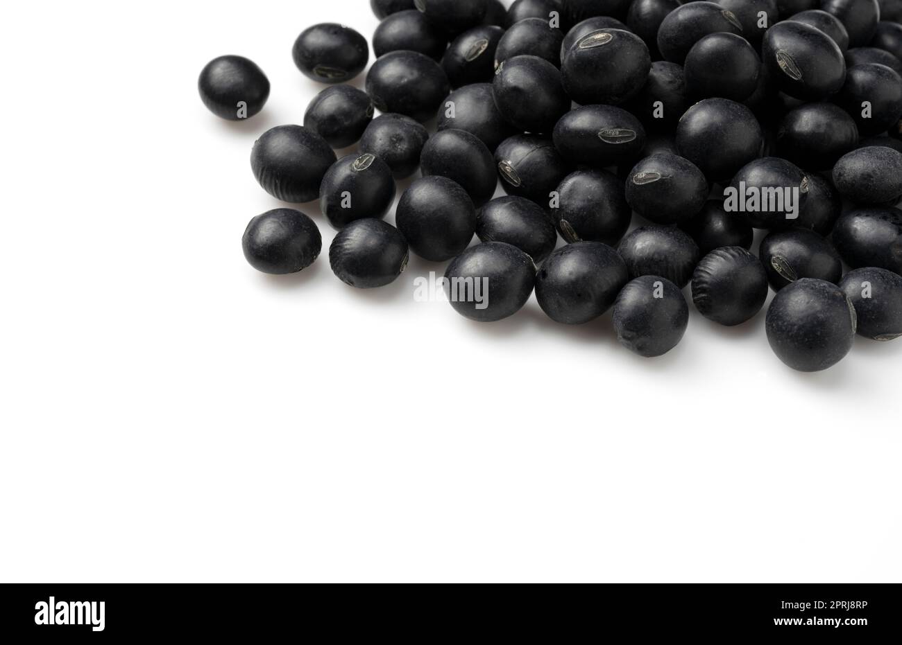 Black beans placed on a white background. Black soybeans (kurodazu Stock Photo Alamy
