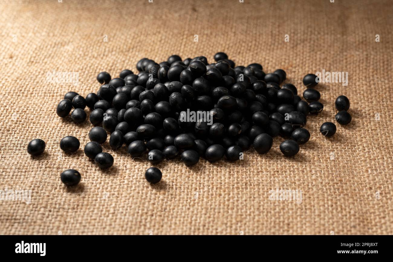 Black soybeans placed on jute Stock Photo Alamy