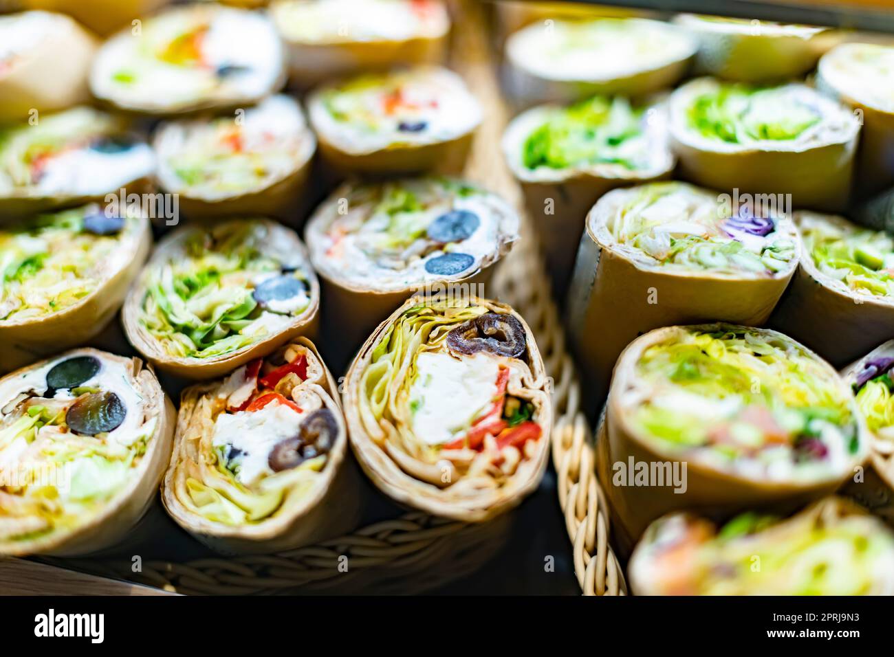 Freshly prepared tortilla wraps sold in a fast food restaurant Stock