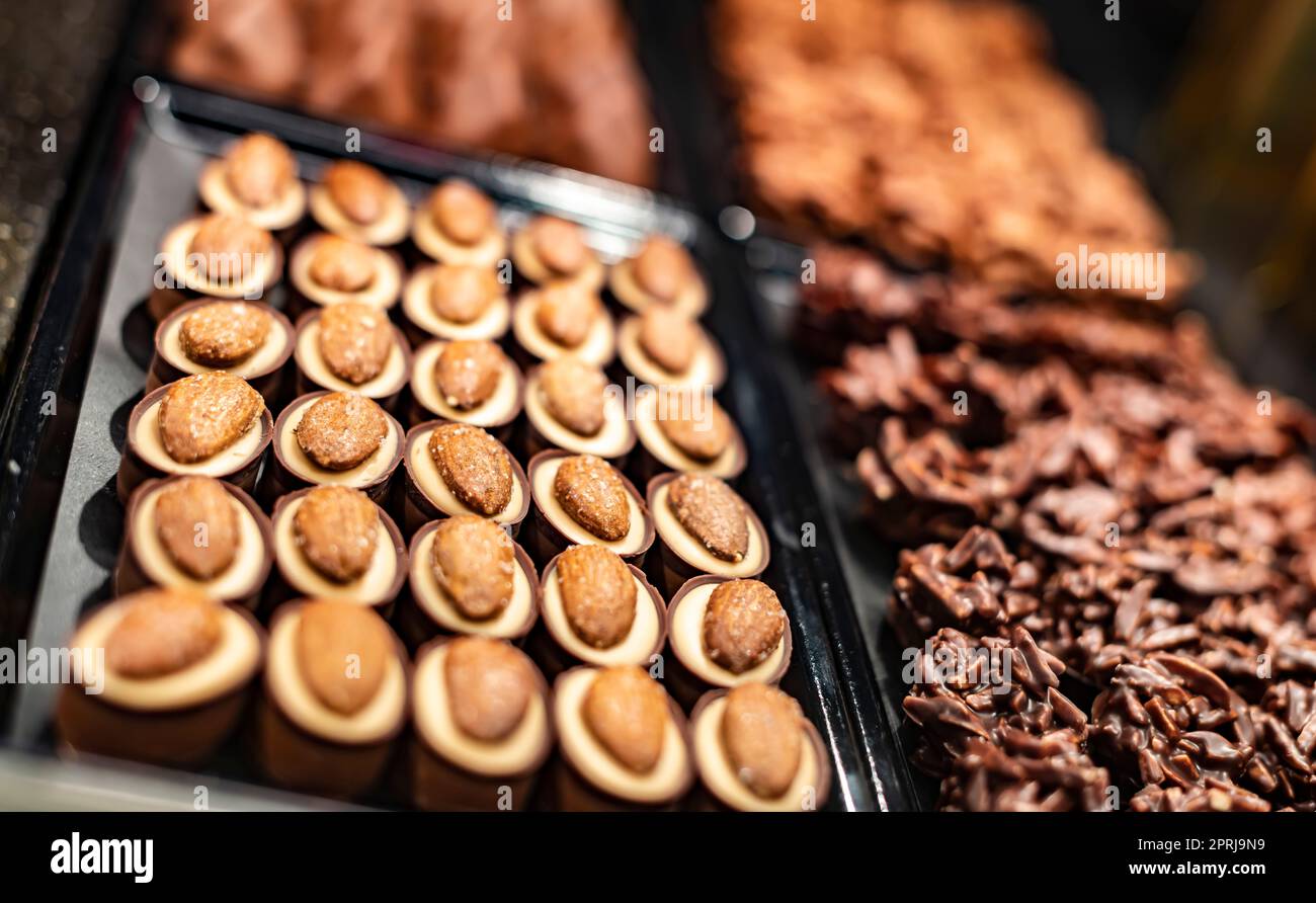 Chocolate pralines displayed in a confectionery store Stock Photo