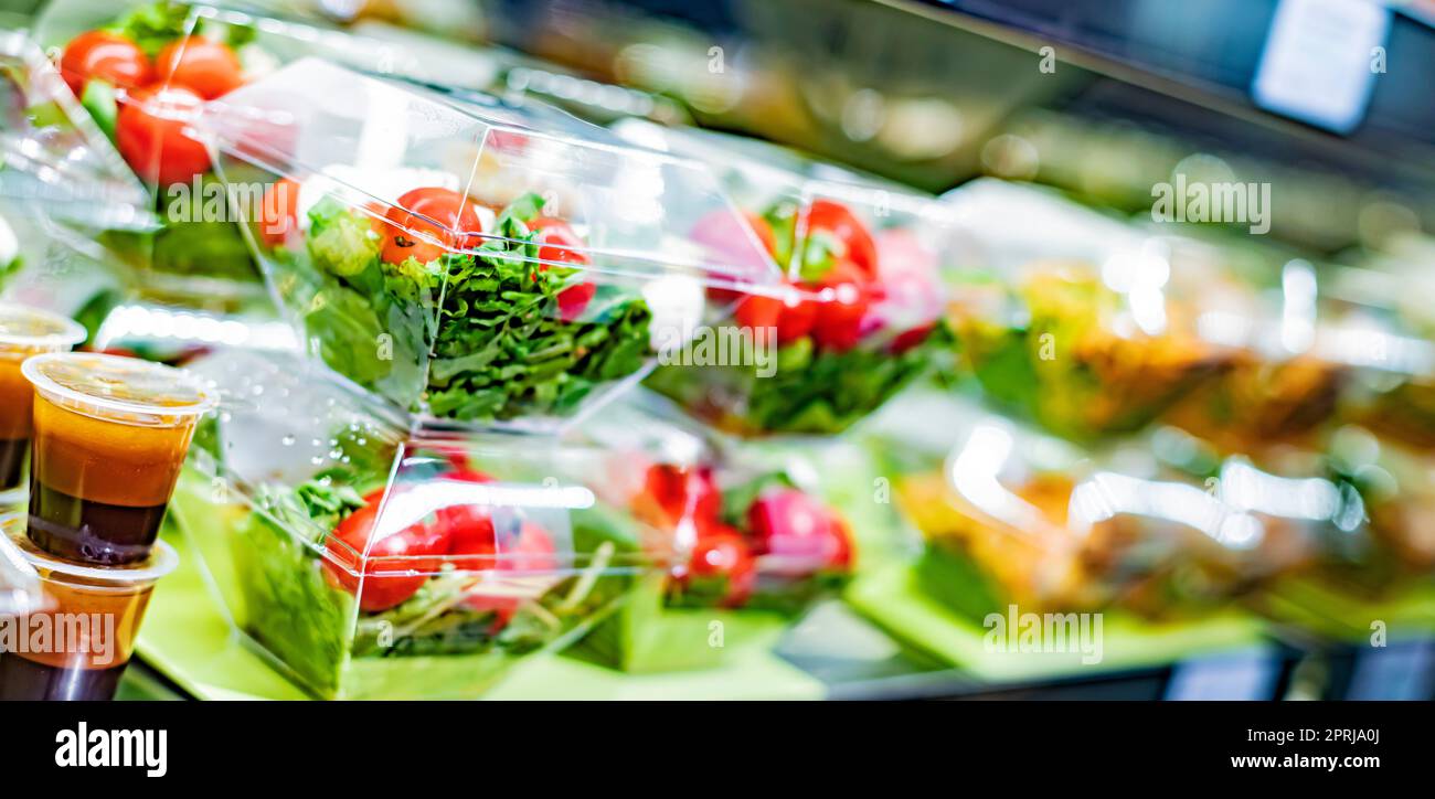 Vegetable salads displayed in a commercial refriger Stock Photo