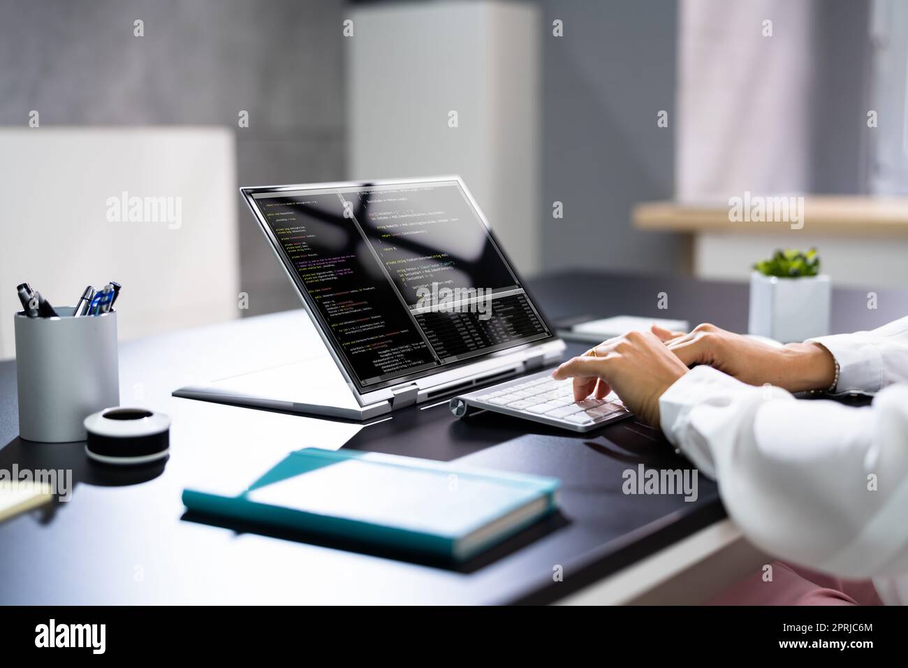 Programmer Or Coder At Office Desk Stock Photo