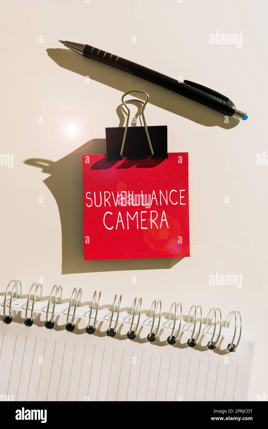Sign displaying Surveillance Camera. Business concept Closed Circuit Television transmit signal on monitors Stock Photo