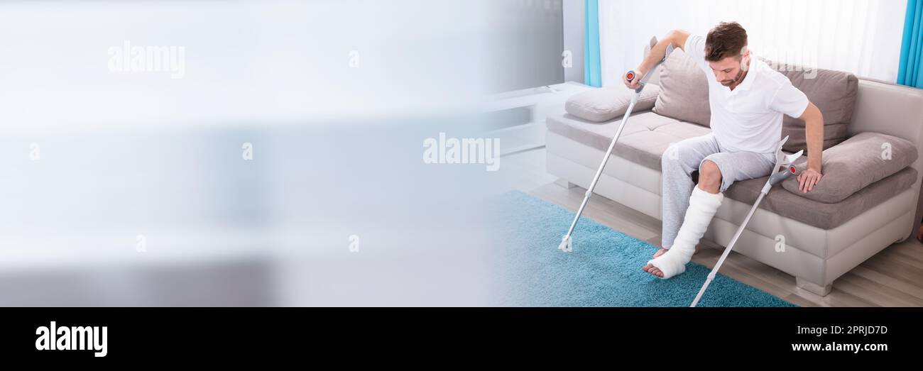 Broken Leg Man With Crutches After Accident Stock Photo Alamy