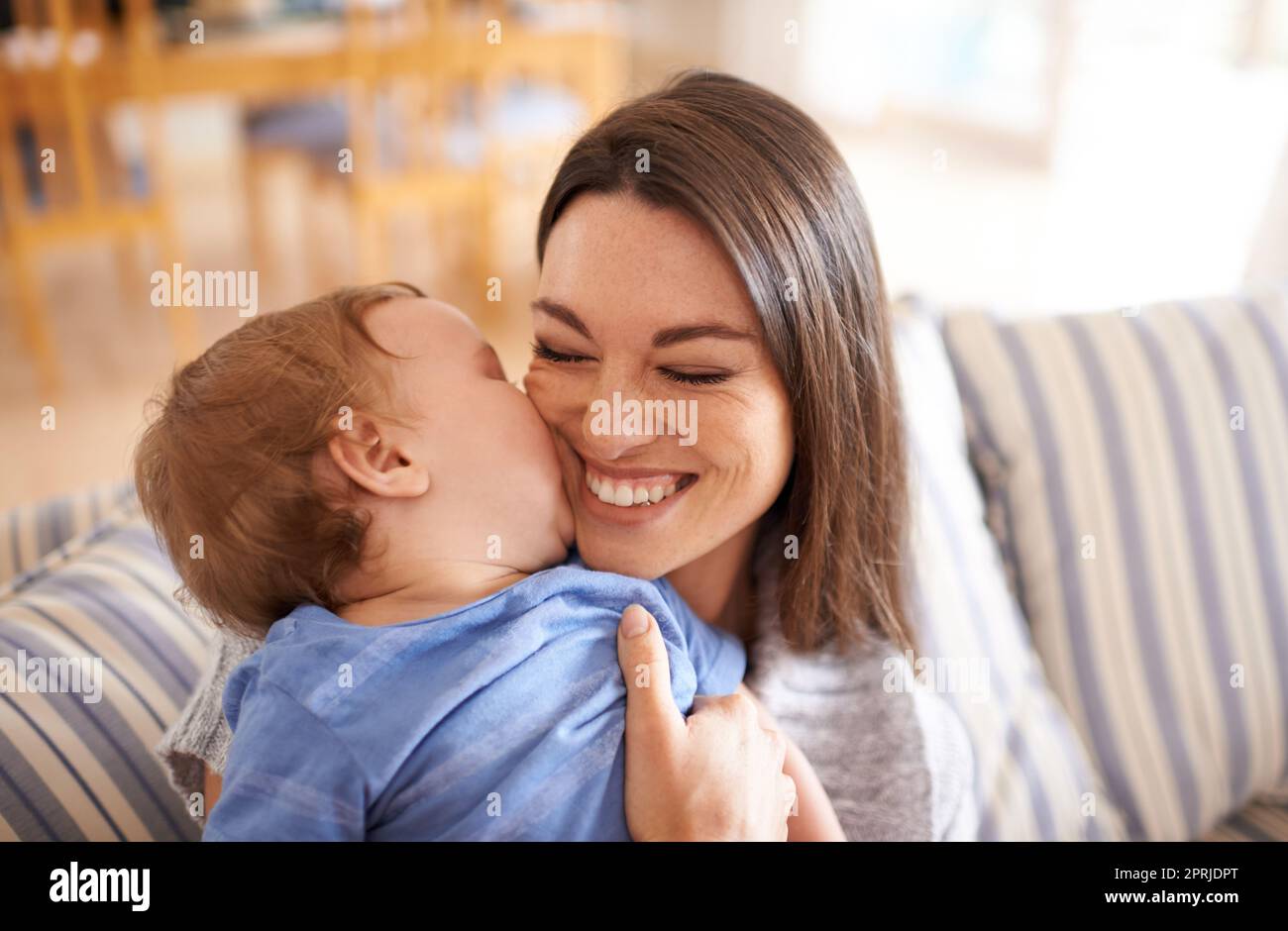 She takes after her mom. An adorable little girl with her mother Stock