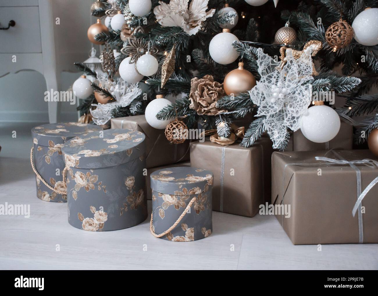 many different boxes with gifts under the tree Stock Photo