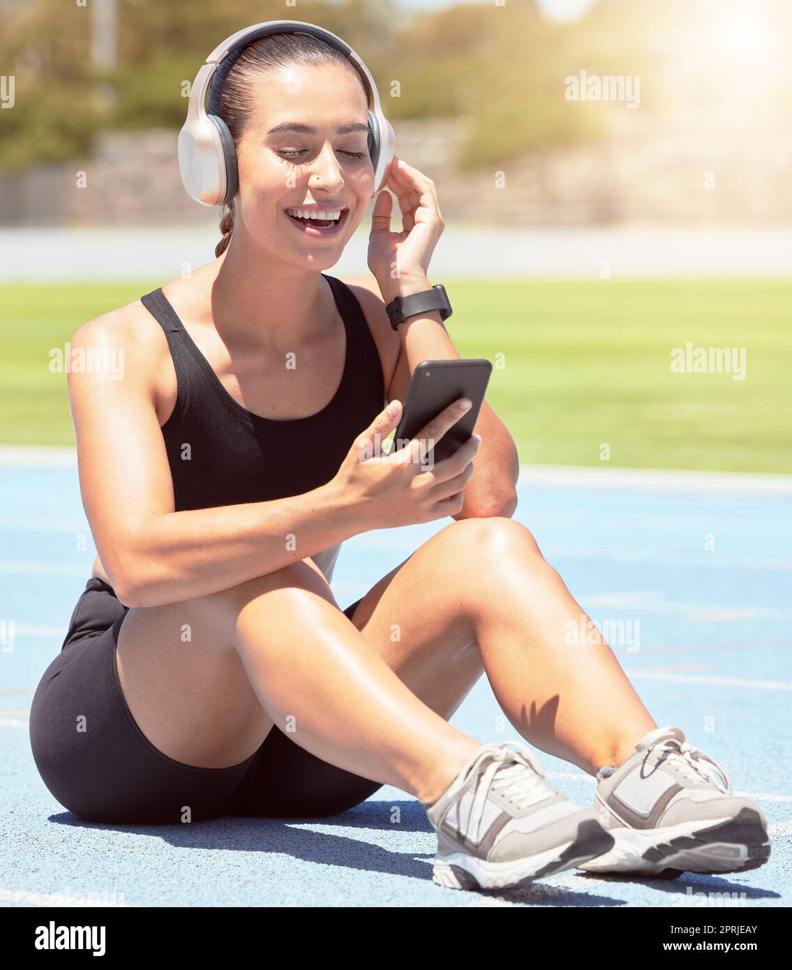 Fitness, phone and exercise with woman listening to motivation training and  wellness podcast during outdoor workout. Music, radio and relax by happy  Stock Photo - Alamy