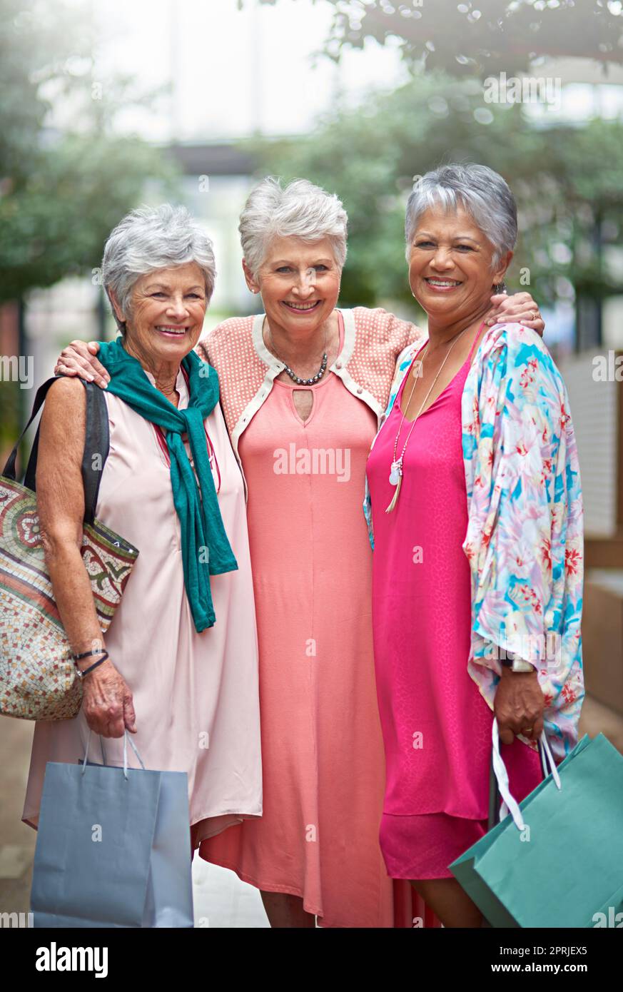 We love our shopping sprees. Cropped portrait of a three senior women out on a shopping spree. Stock Photo