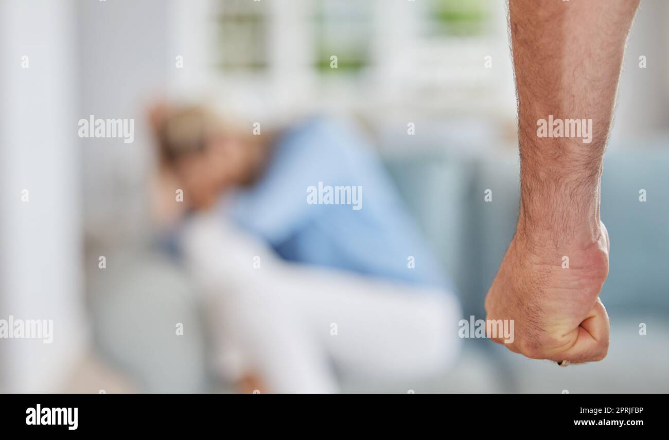 Domestic violence in home, angry man fist threaten fear in scared woman and awareness of abuse pain. Physical conflict aggression, marriage problems w Stock Photo