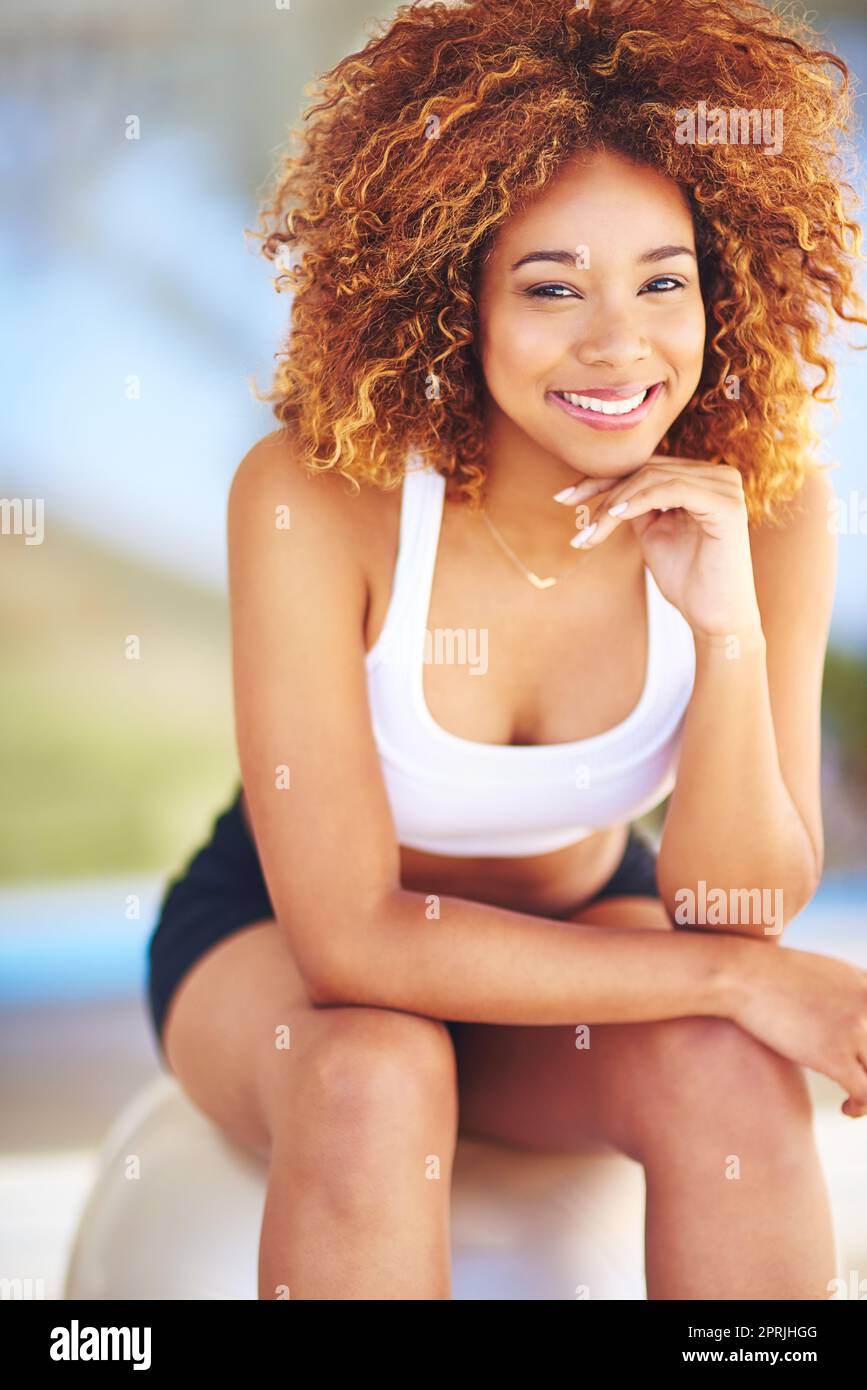 All it takes is all you got. a sporty young woman sitting on a swiss ball. Stock Photo