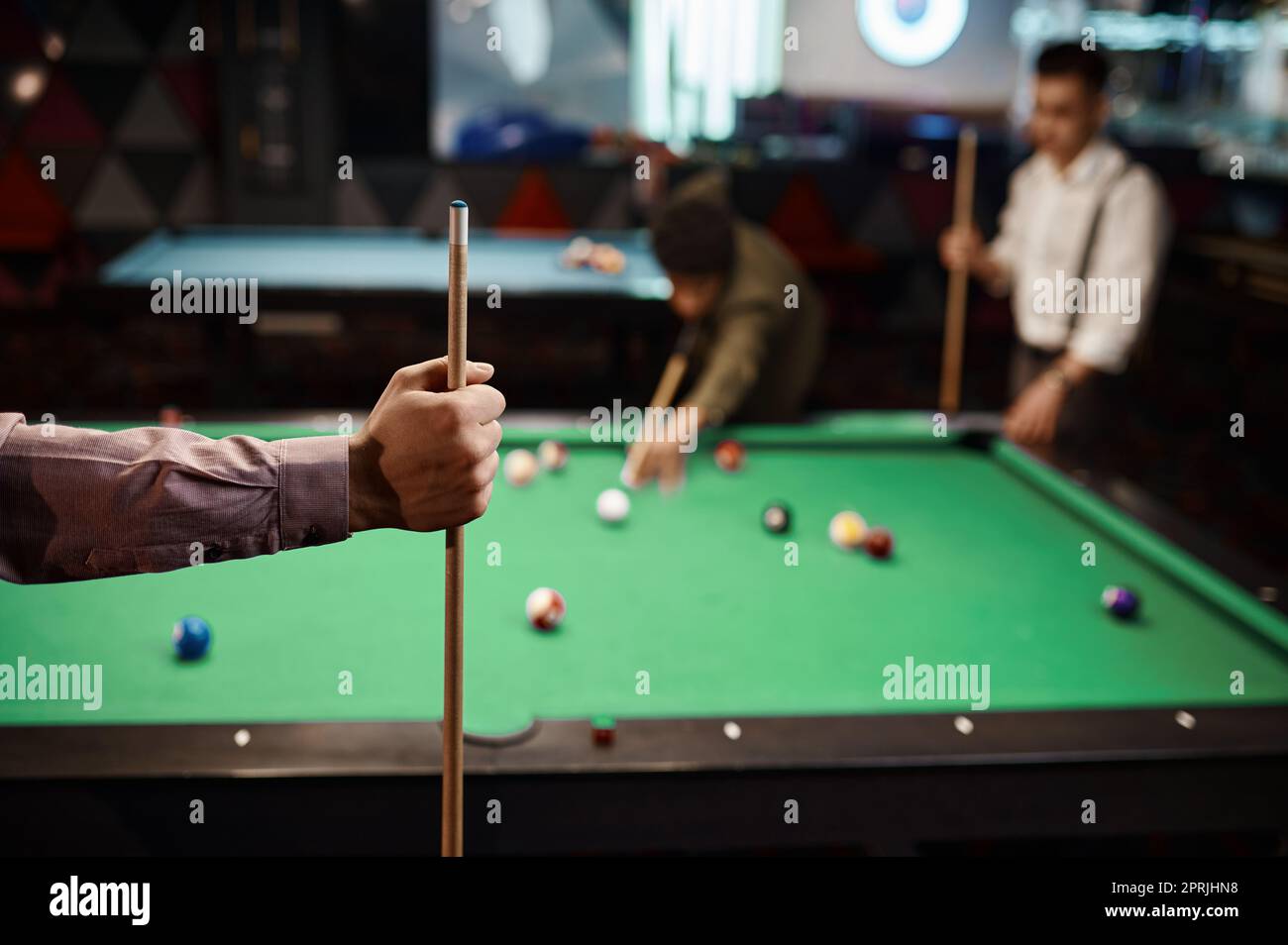 Friends playing billiards, selective focus Stock Photo