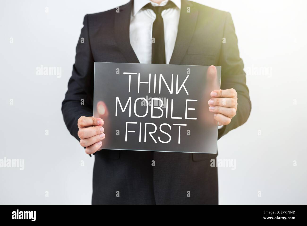 Hand writing sign Think Mobile FirstEasy Handheld Device Accessible